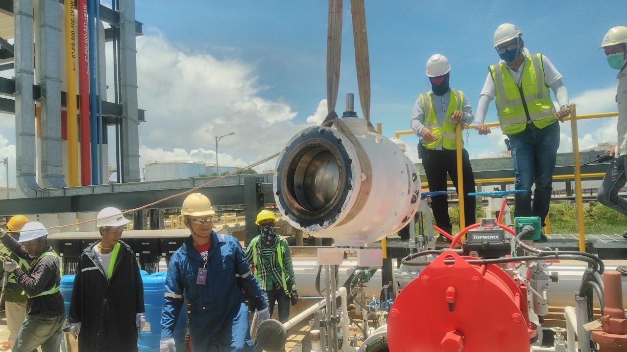 GIE technicians working on industrial equipment